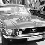 Mustang Auto - a black and white photo of a mustang
