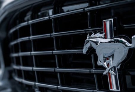 Mustang Auto - A Ford Mustang Emblem on a Car