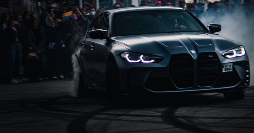 Mustang Drag Racing - Crowd Watching a BMW M3 Sports Car Driving at a Street Race