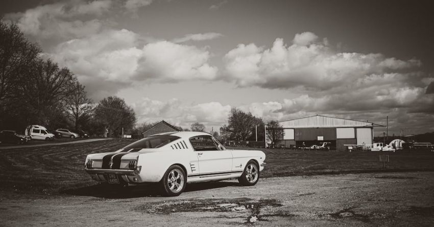 Mustang Restorations - A black and white photo of a classic car