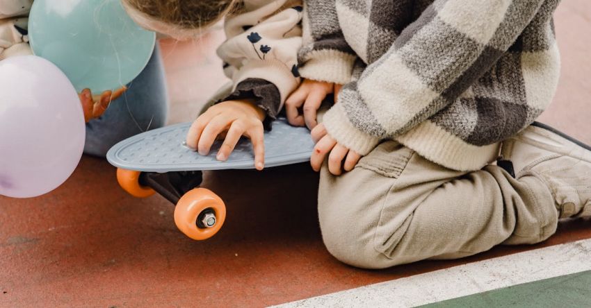 Mustang Track Days - Unrecognizable children pastime together near skateboard outside