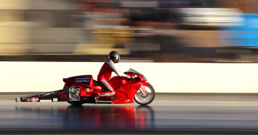 Mustang Drag Racing - Man Riding Red Sports Bike